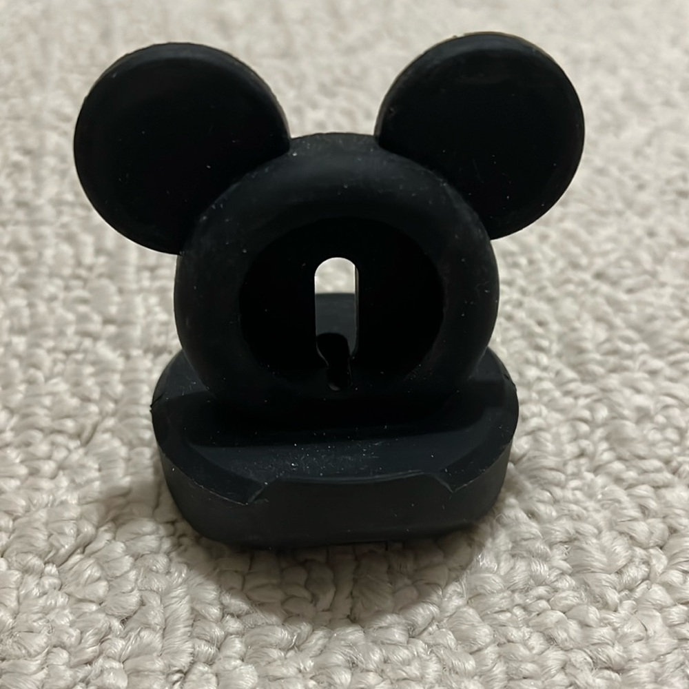 Silicone Disney Mickey shaped Apple Watch charging “puck” holder.